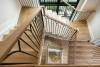 Minimalist Staircase with Natural Wood and Iron Details